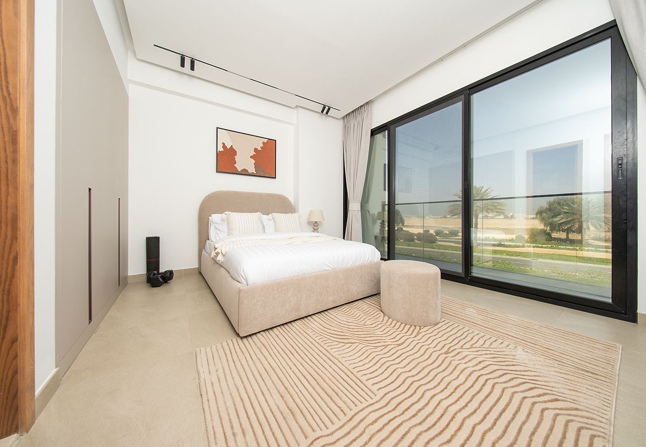 Apartment in Ajman - Luxury 3BR with Golf & Lake Views