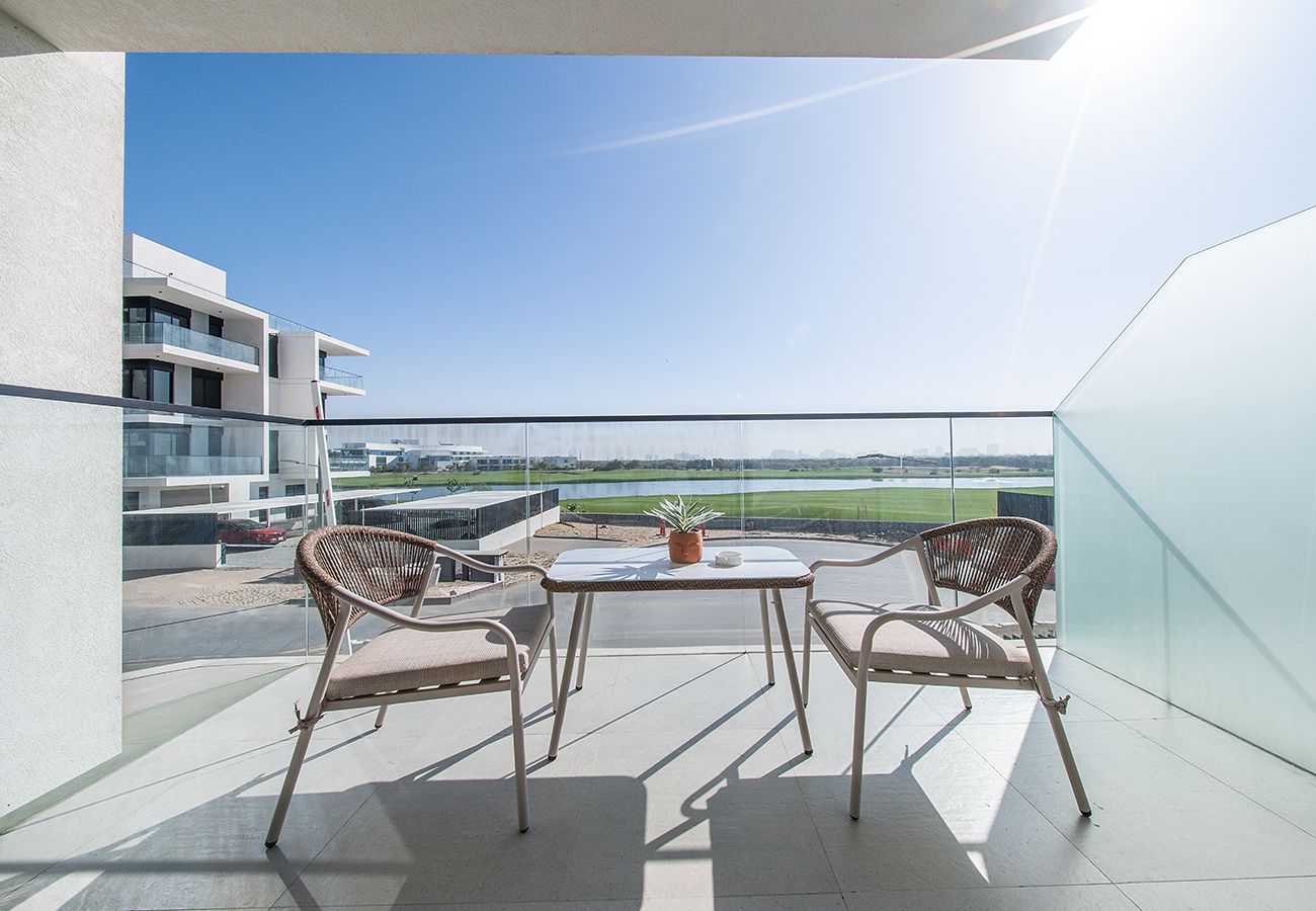 Apartment in Ajman - Luxury 3BR with Golf & Lake Views