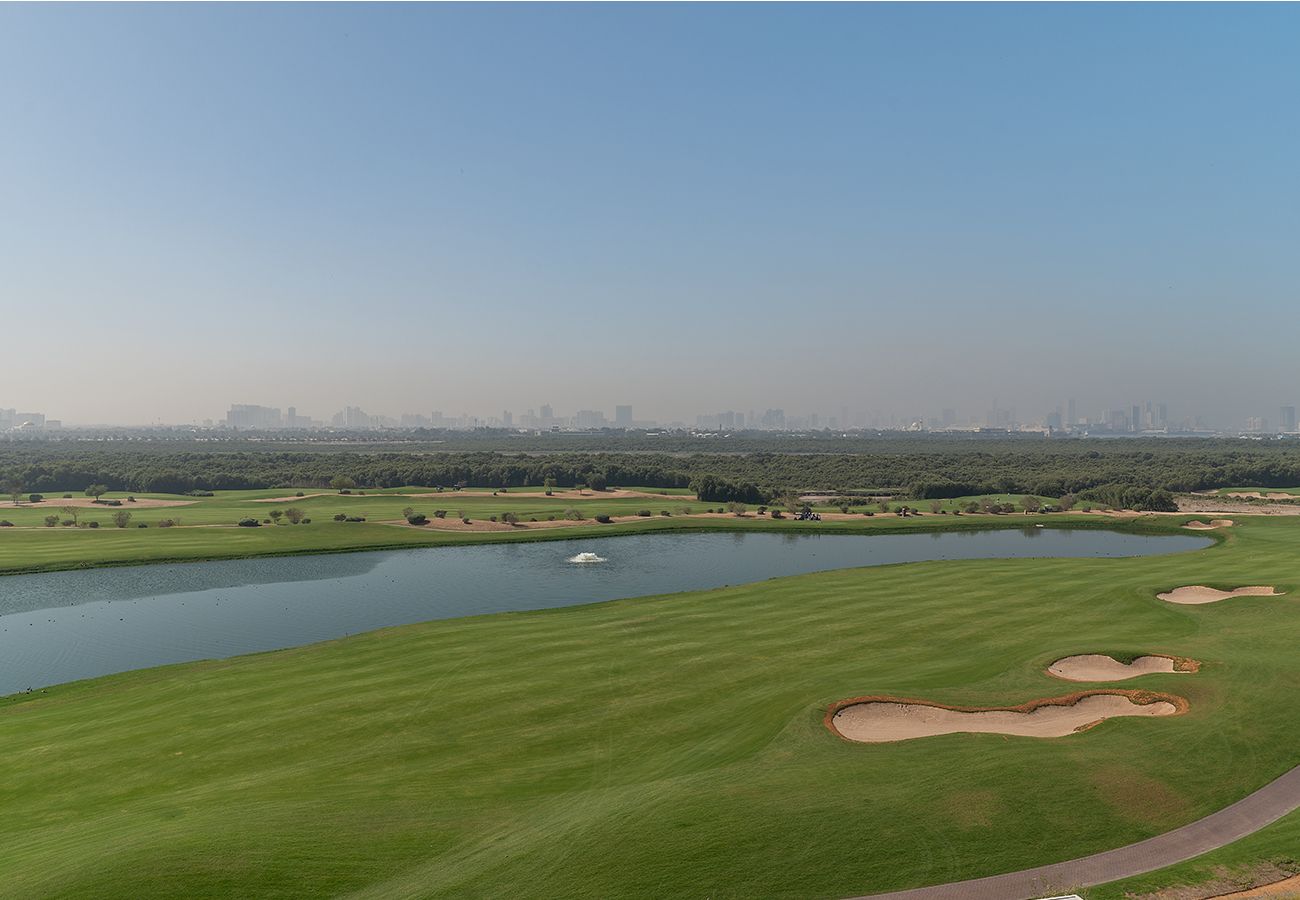 Apartment in Ajman - Luxury 3BR with Golf & Lake Views