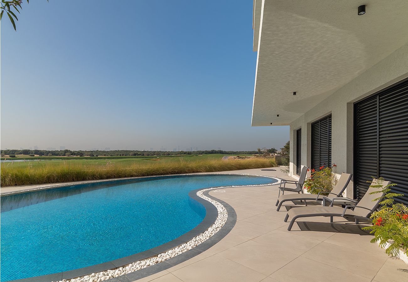 Apartment in Ajman - Luxury 3BR with Golf & Lake Views