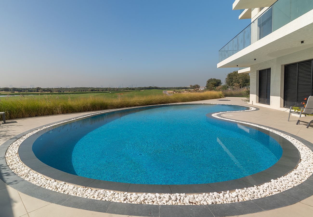 Apartment in Ajman - Luxury 3BR with Golf & Lake Views